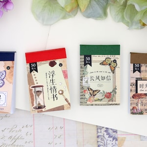 May include: Four small, colorful notebooks with vintage designs. Each notebook has a different design featuring butterflies, flowers, musical notes, and an hourglass. Each notebook has a title in Chinese characters and the text "50 sheets".