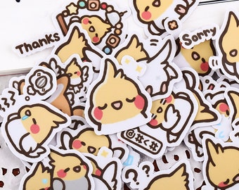 May include: A collection of assorted stickers featuring cartoon cockatiels in various poses. The stickers are primarily yellow, white, and brown, with pink accents. Some stickers have text, including "Thanks" and "Sorry".