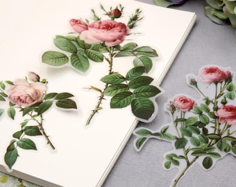 May include: Three sheets of pink rose floral stickers. The stickers are printed on clear, transparent paper. The roses are pink with green leaves and stems.