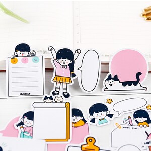 May include: A set of colorful stickers featuring cartoon girls, cats, and speech bubbles. The stickers are perfect for adding a touch of whimsy to planners, journals, and other paper goods. The stickers include the text "checklist" and "week plan".