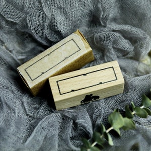 May include: Two wooden rectangular stamps with black ink outlines. The stamps are blank and ready to be used for crafting and scrapbooking.
