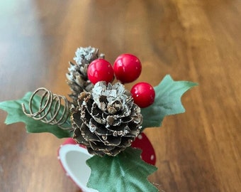Adorable Christmas Napkin Ring embellished with holly, berries, pine cones and a tiny corkscrew. So so cute!
