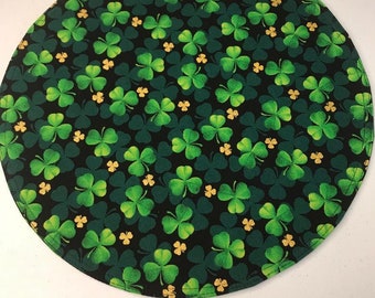 15" Circular Placemats featuring colorful green shamrocks, sold individually.