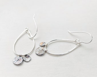 Handcrafted silver pebble drop earrings with oxidised detail