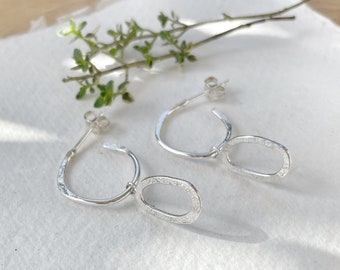 Small lightweight silver hoops with oval silver charm