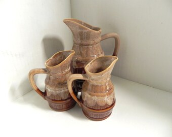 A Set Of Three French Wine Pitchers. Dip Glazed Wine Barrels