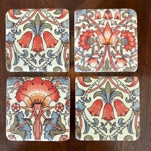 A Set of four William Morris Arts & Crafts Drinks Coasters With Lotus Motif