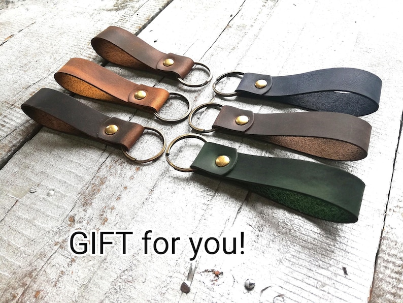 Six leather keychains, green, brown, dark. town, blue, black color. Text" Gift for you"!