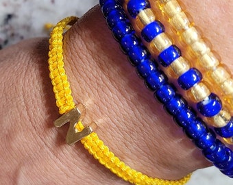 Handcrafted Woven Bracelet with Gold 'N' Charm