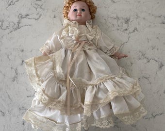 Mann Vintage Porcelain Doll Cream Lace Dress Curly Hair Blue Eyes Collectible
