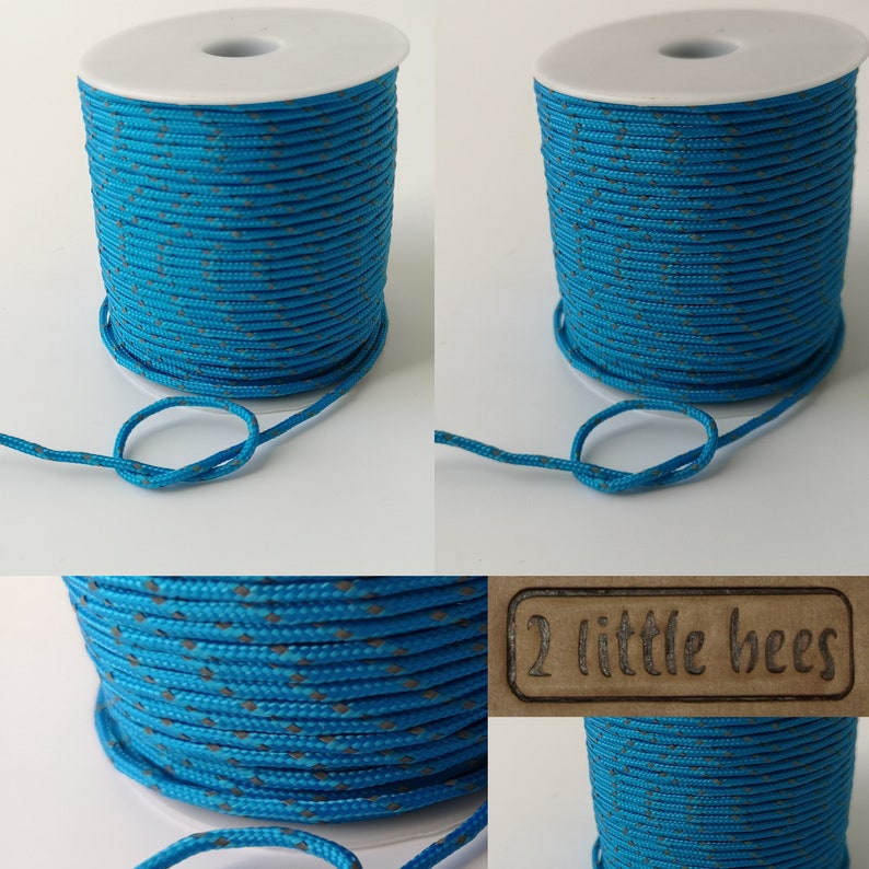 May include: A spool of turquoise blue cord with a grey diamond pattern. The cord is wound around a white plastic spool. The spool is labeled "2 little bees".