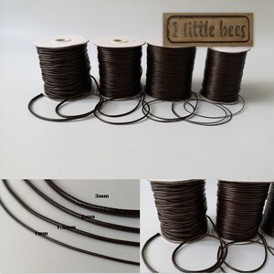 May include: Four spools of brown leather cord in various sizes, 1mm, 1.5mm, 2mm, and 3mm. The spools are labelled with the cord size. The cord is a dark brown colour and has a smooth texture.