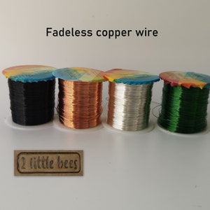 May include: Four spools of fade-resistant copper wire in black, copper, silver, and green. The spools are labelled "Fade-Resistant Copper Wire".