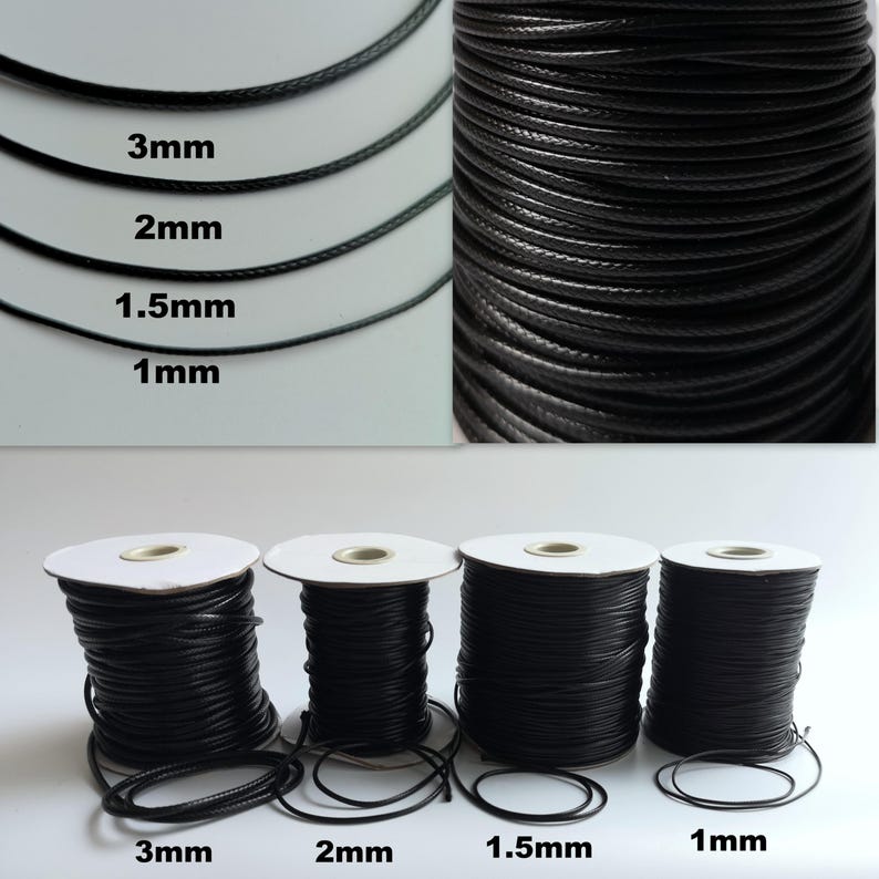 May include: Four spools of black waxed cotton cord in different sizes: 1 mm, 1.5 mm, 2 mm, and 3 mm. The cord is wound around white spools.