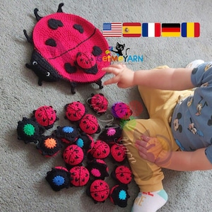 May include: A collection of handmade crochet ladybug toys in red, black, and various colours. The set includes a large ladybug mat and several smaller ladybug toys. The image also shows the text "getmEYarn".