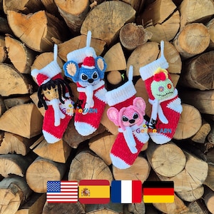 May include: Four handmade crochet Christmas stockings in red and white, each with a different character design. The stockings are set against a backdrop of stacked firewood. The text "GeMeYARN" is visible on the stockings.