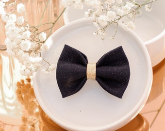Pin's midnight blue bow and golden sequin