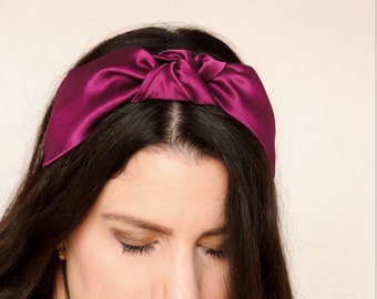 Knotted effect headband in thick pink/magenta red satin