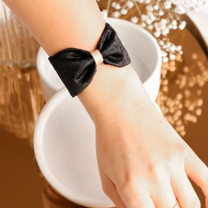 Black iridescent crepe bow cuff
