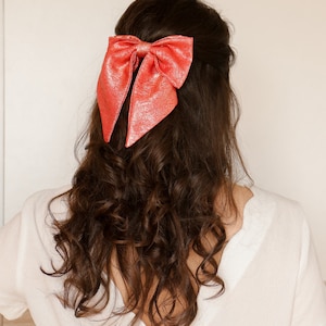 Maxi bow barrette in iridescent coral crepe image 1