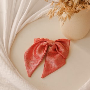 Maxi bow barrette in iridescent coral crepe image 2