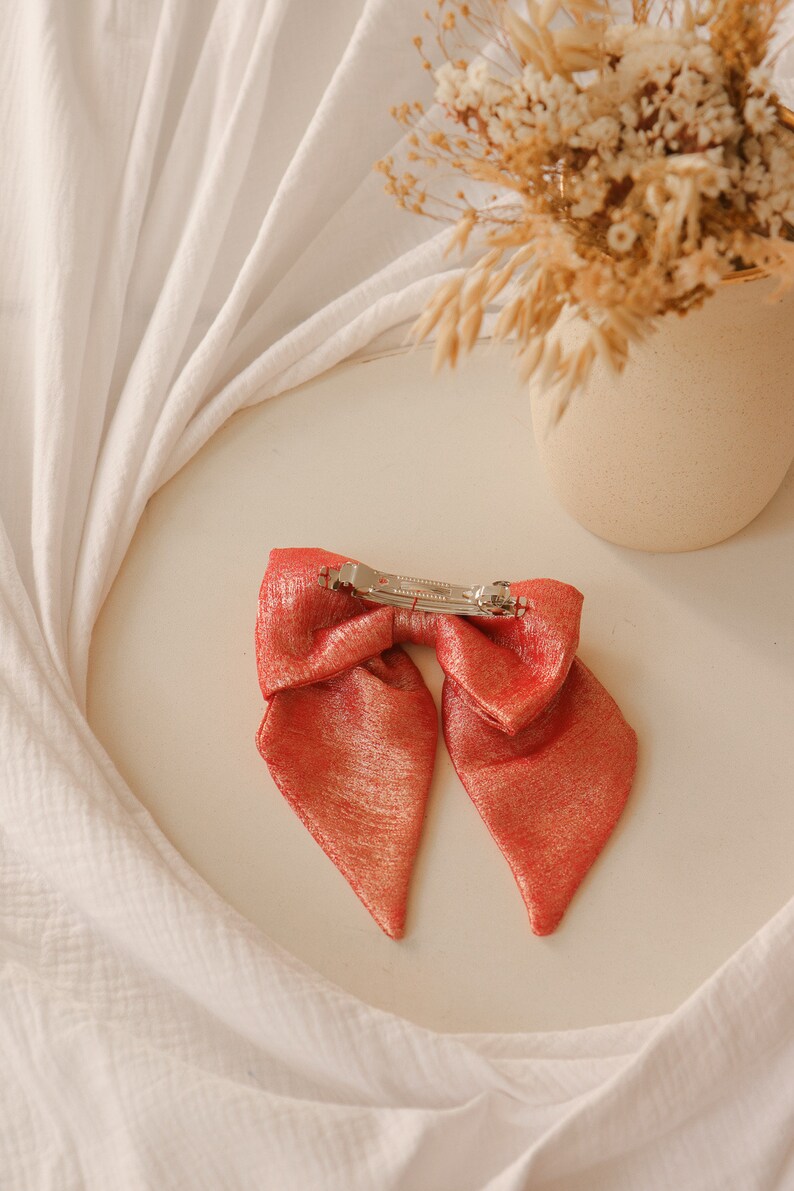 Maxi bow barrette in iridescent coral crepe image 3