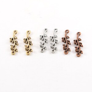 May include: Six metal leaf branch connectors in three different finishes: gold, silver, and copper. Each connector has two loops for attaching to jewelry or other crafts.