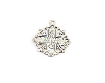 May include: A silver pendant featuring a detailed cross with a figure of a saint in the center.