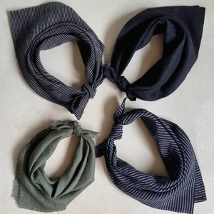 May include: Four different fabric bandanas in various colors and patterns. The bandanas are made of a soft, woven fabric and have a frayed edge. The bandanas are arranged in a circle on a white background.