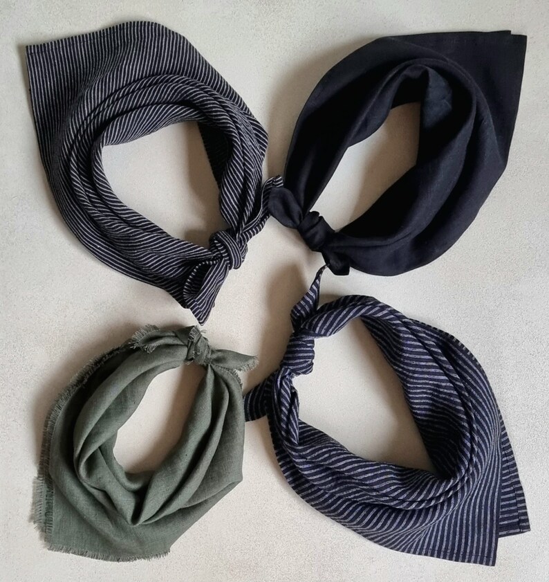 May include: Four different fabric bandanas in various colors and patterns. The bandanas are made of a soft, woven fabric and have a frayed edge. The bandanas are arranged in a circle on a white background.