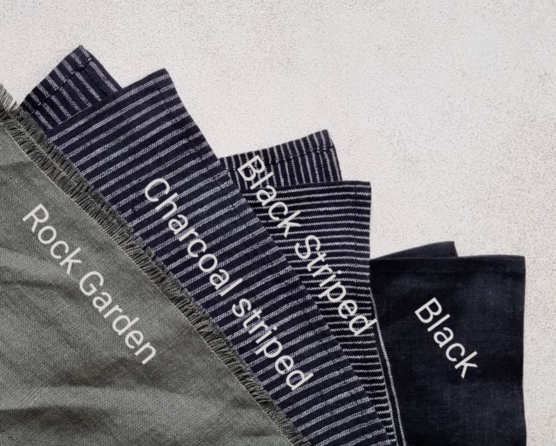 May include: Four fabric swatches in different colors and patterns. The swatches are labeled "Rock Garden", "Charcoal striped", "Black striped", and "Black".