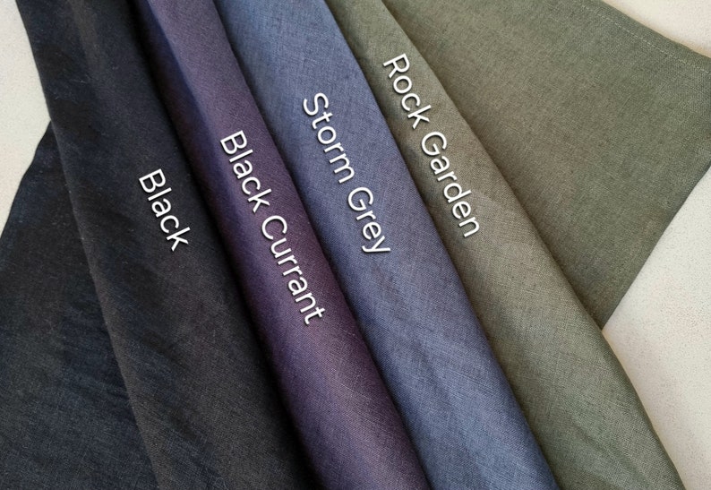 May include: Five fabric swatches in different shades of gray, black, and green. The swatches are labeled "Black", "Black Currant", "Storm Grey", "Rock Garden".