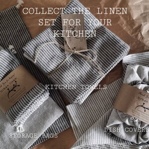 May include: A set of striped linen kitchen towels, storage bags, and dish covers. The towels are tied together with twine and a tag that reads "Collect the linen set for your kitchen". The bags and covers are folded and arranged on a brown paper background.