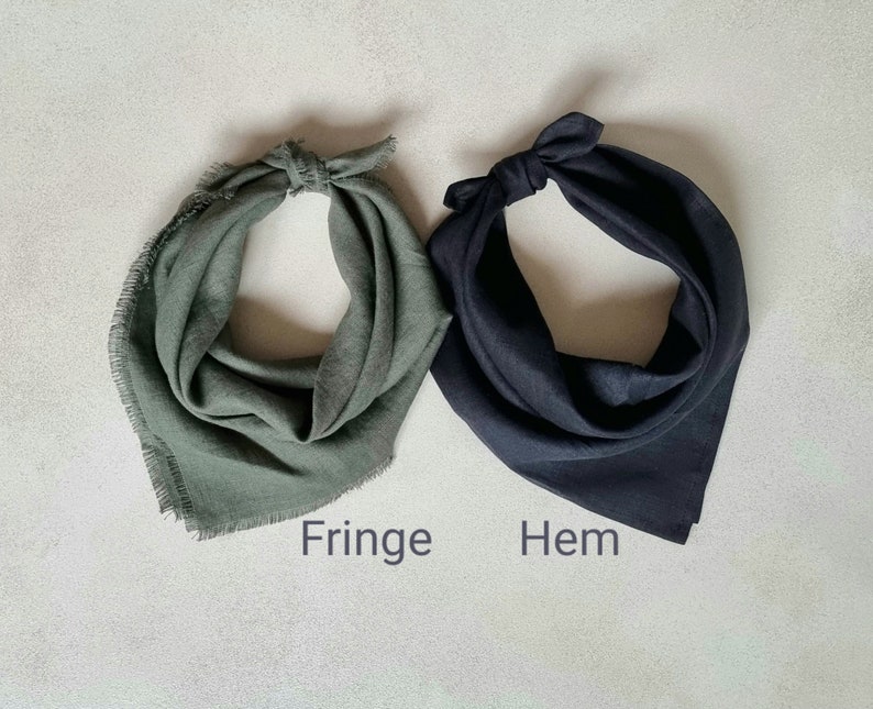 May include: Two fabric bandanas, one green with a fringed edge and one black with a hemmed edge. The bandanas are laid flat on a light gray surface. The words "Fringe" and "Hem" are written below the bandanas.