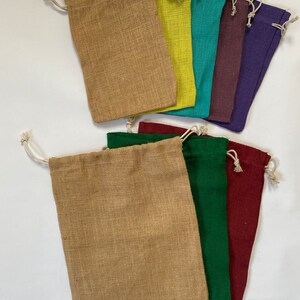 May include: Set of ten small burlap drawstring bags in various colors, including brown, yellow, teal, purple, green, and red.