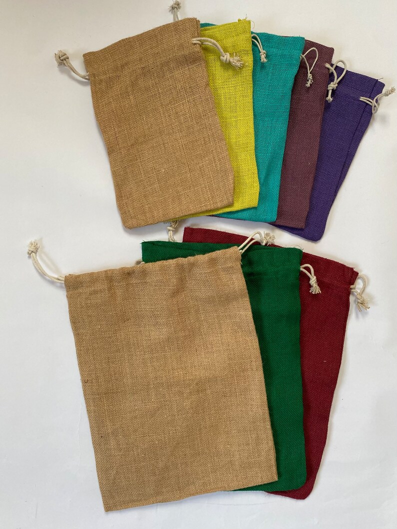 May include: Set of ten small burlap drawstring bags in various colors, including brown, yellow, teal, purple, green, and red.