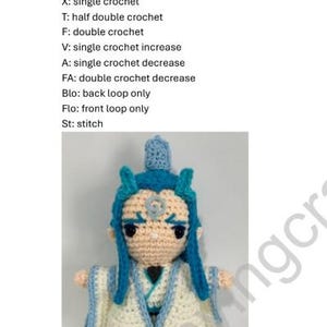 May include: Crocheted amigurumi doll of a character with blue hair, a white robe, and a light blue face. The doll is wearing a white robe with blue trim. The doll is holding a blue staff. The doll is standing on a white background. The text "Ao Bing Crochet Pattern" is at the top of the image.