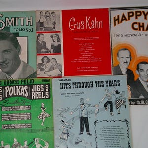 May include: A collection of vintage sheet music covers. Titles include "Carl Smith Folio No. 1", "Gus Kahn", "Happy Chappies", "Edwards Dance Folio", and "Hits Through The Years". The covers feature illustrations and portraits.
