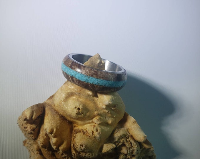 Stabilized maple burl ring with turquoise inlay and steel core.