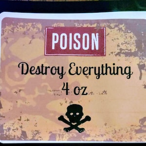 May include: A vintage-style label with a red warning sign that reads "POISON". The label also says "Destroy Everything" and "4 oz" with a black and white skull and crossbones image.