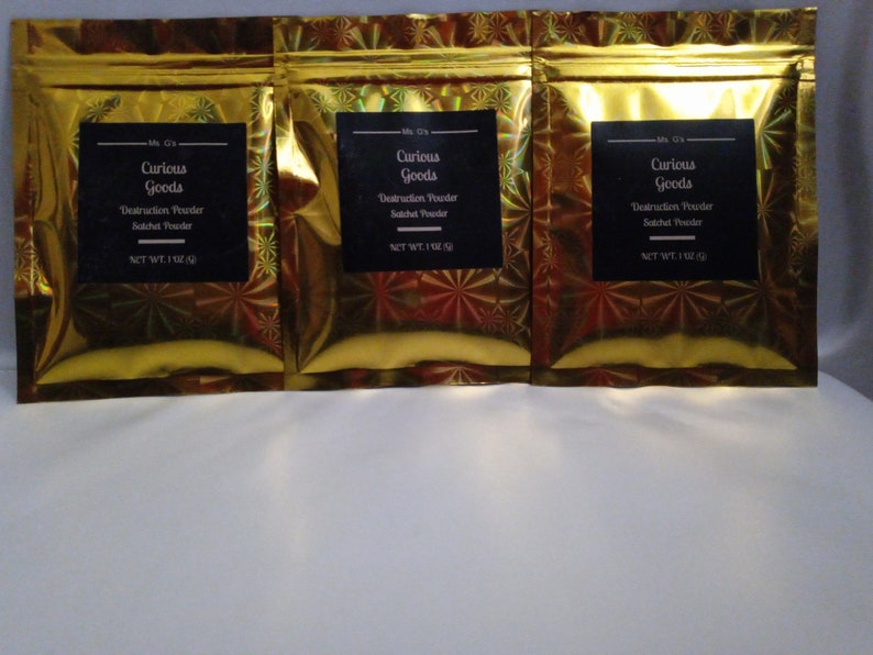 May include: Three gold foil pouches with black labels that read "Curious Goods" and "Destruction Powder Satchel Powder" with a net weight of 1 oz.
