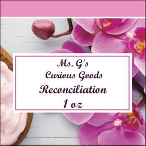 May include: A white label with the text "Ms. G's Curious Goods Reconciliation 1 oz" on a light blue wooden background with pink orchid flowers.