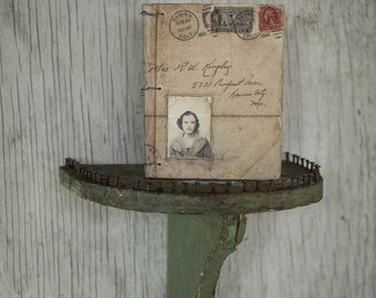 Handmade artist book and custom shelf.