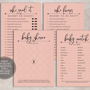 May include: Four pink baby shower game cards with black text. The first card is a "Who Said It?" game with questions about mommy or daddy. The second card is a "Who Knows?" game with questions about the mommy-to-be. The third card is a baby shower bingo card. The fourth card is a baby match game with a list of baby-related words and phrases.