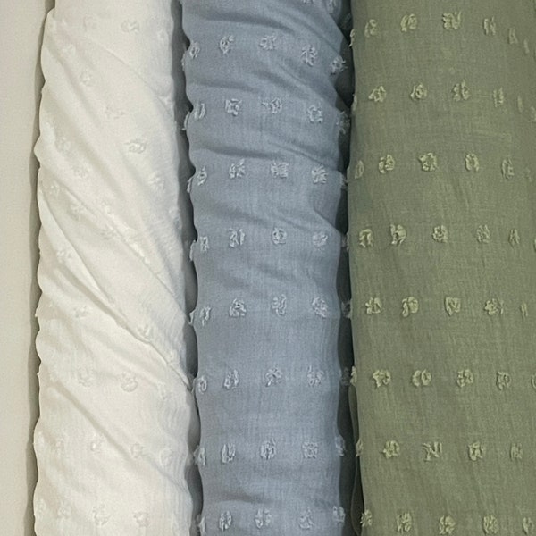 Swiss Dot Woven 100% polyester with natural stretch white , blue , green , beige , plum , dusty rose  (sold by the half yard )