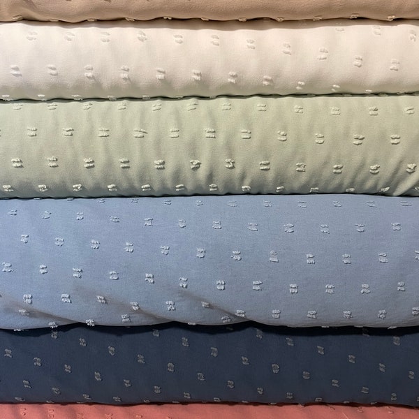 100 % polyester Swiss Dot , Tan , White , Sage , Blue , Denim . Salmon (sold by the half yard )