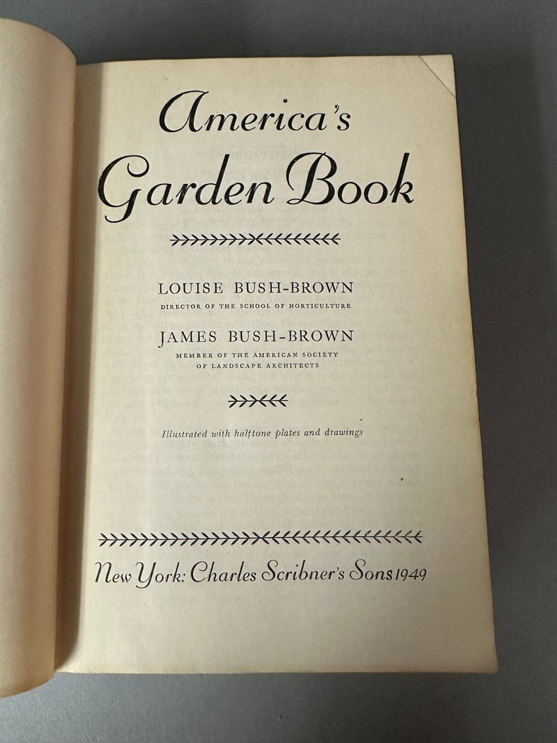 May include: A vintage book titled "America's Garden Book" by Louise Bush-Brown and James Bush-Brown. The book was published in 1949 by Charles Scribner's Sons in New York.