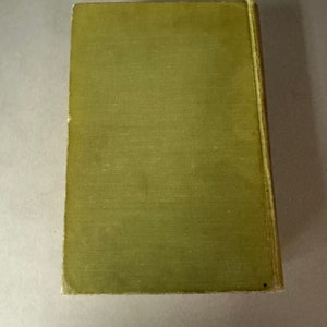 May include: A green hardcover book with a plain cover.