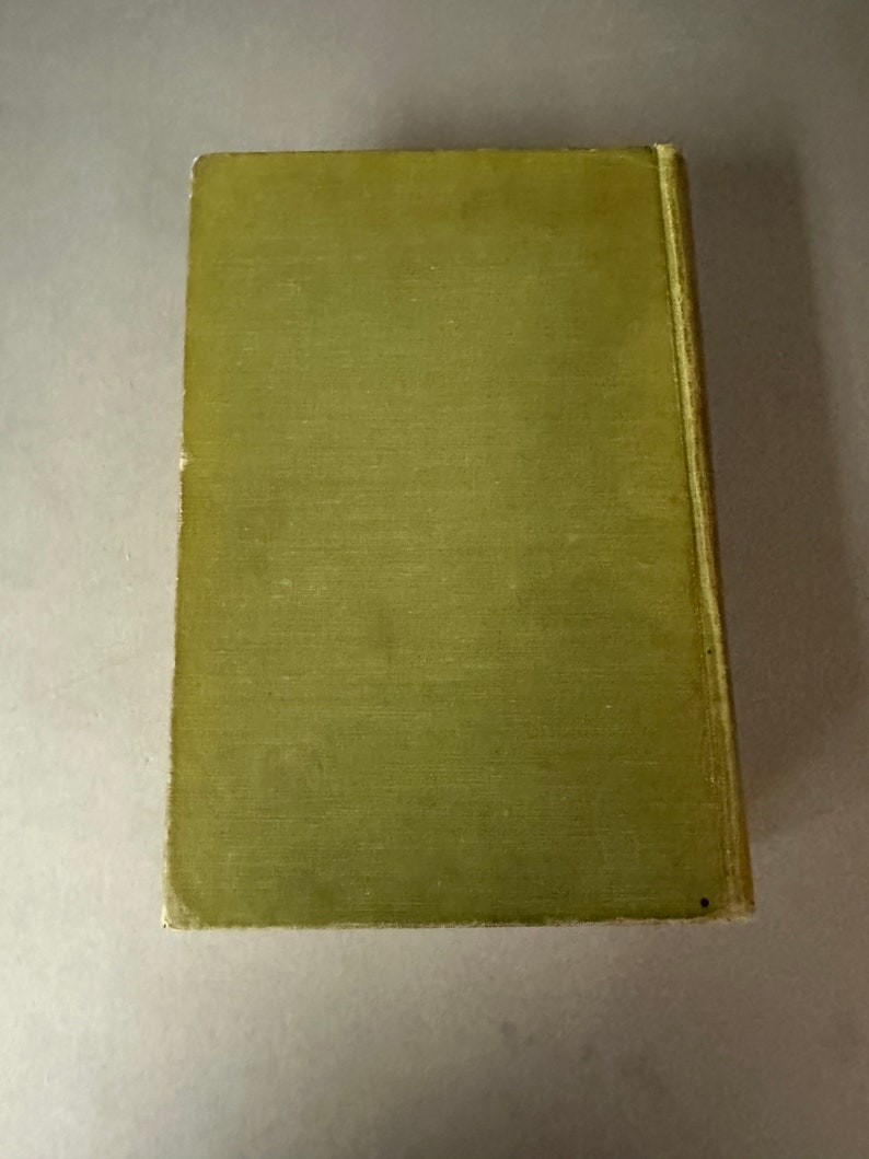 May include: A green hardcover book with a plain cover.