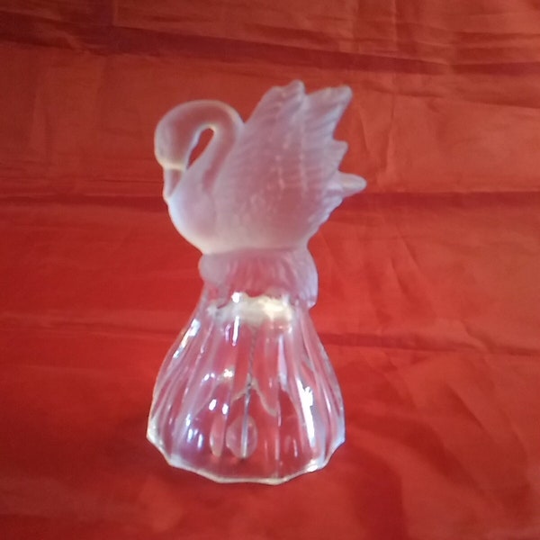 A frosted swan on a nest atop a crystal hand bell that is 4.5" tall.  Misc 1175